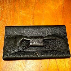 Kate Spade Black 12x7 leather clutch with bow detail NWOT. Classic timeless.